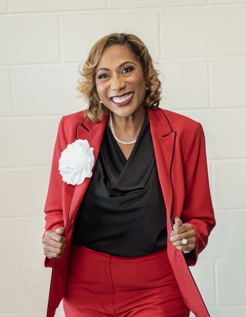 Dr. Stephanie in a red suit